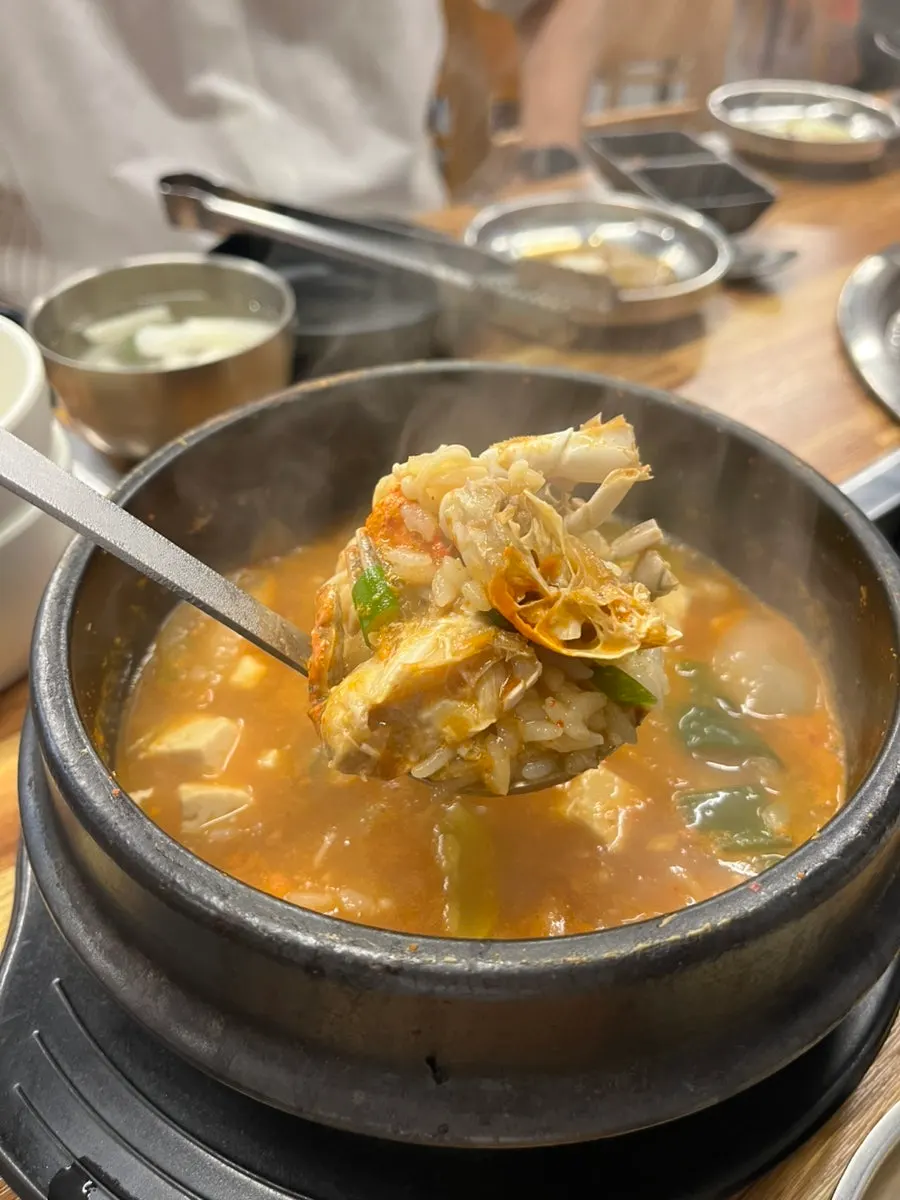 A bowl of seafood doenjang rice with blue crab