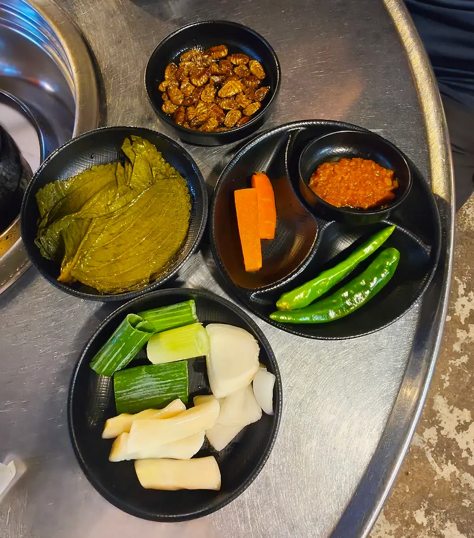 Plate of lettuce and pickled radish for wraps