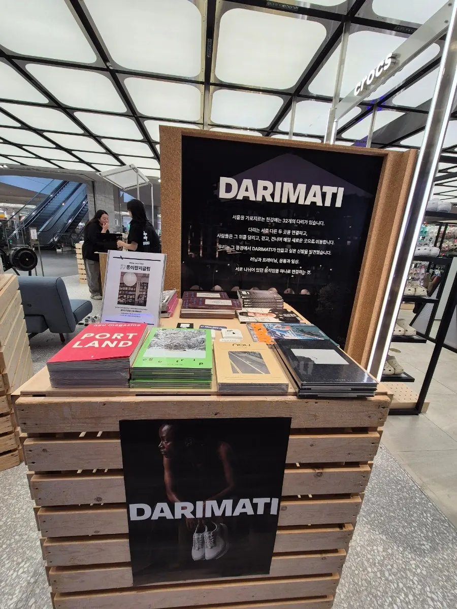 DARIMATI clothing, bags, and hats lineup on display