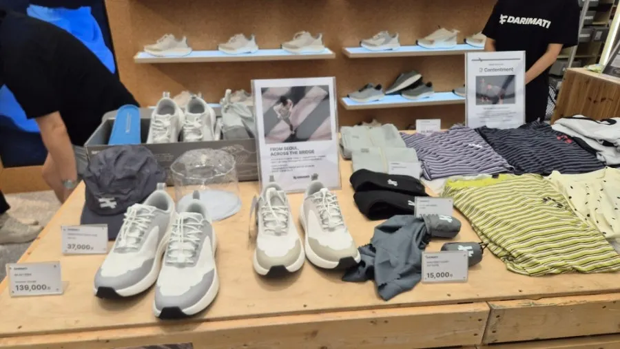 Visitors trying on shoes at the pop-up