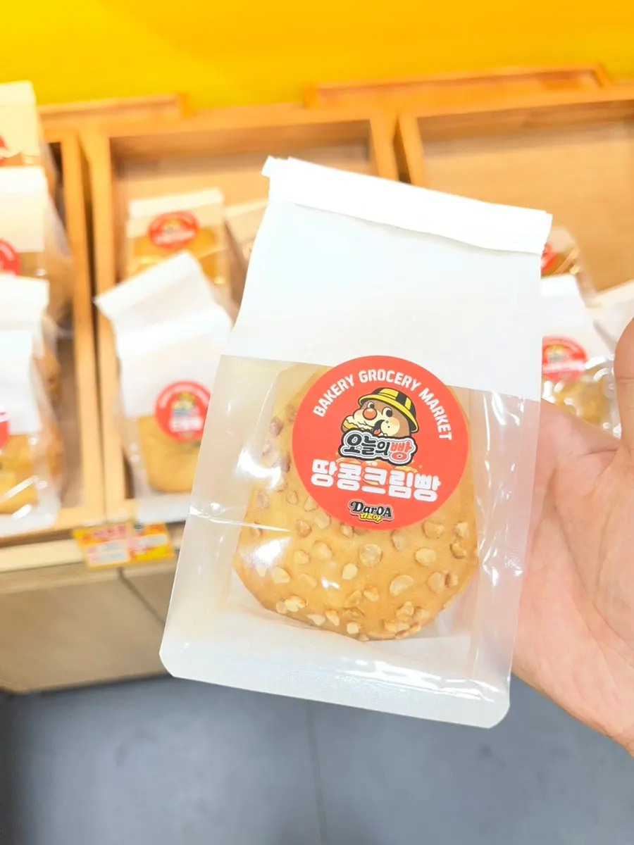 Individually wrapped red bean bread, cream bread and soboro on display
