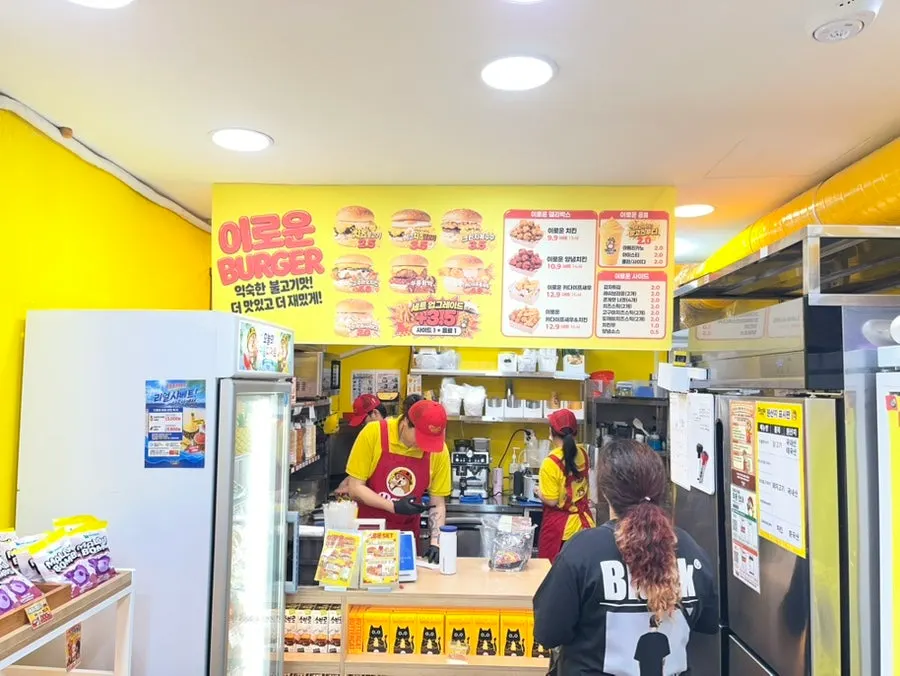 Burger and chicken menu board outside the shop