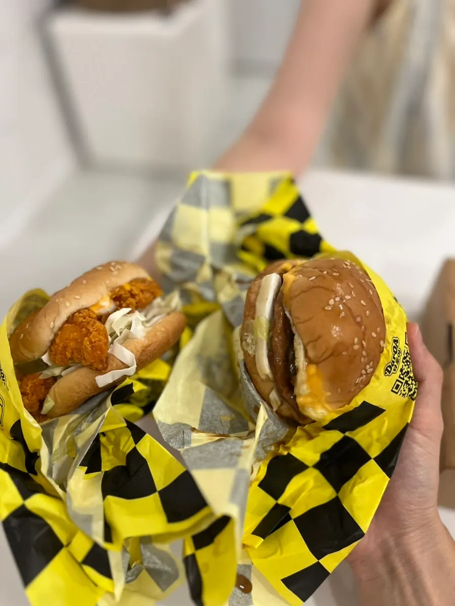 Cross-section of a burger generously packed with cabbage