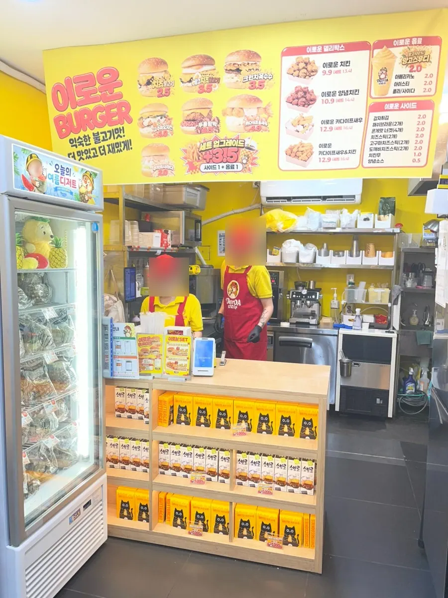 Snacks displayed under the counter and the open kitchen