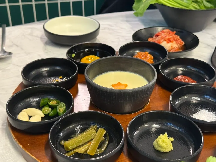 Side dishes laid out on a round table