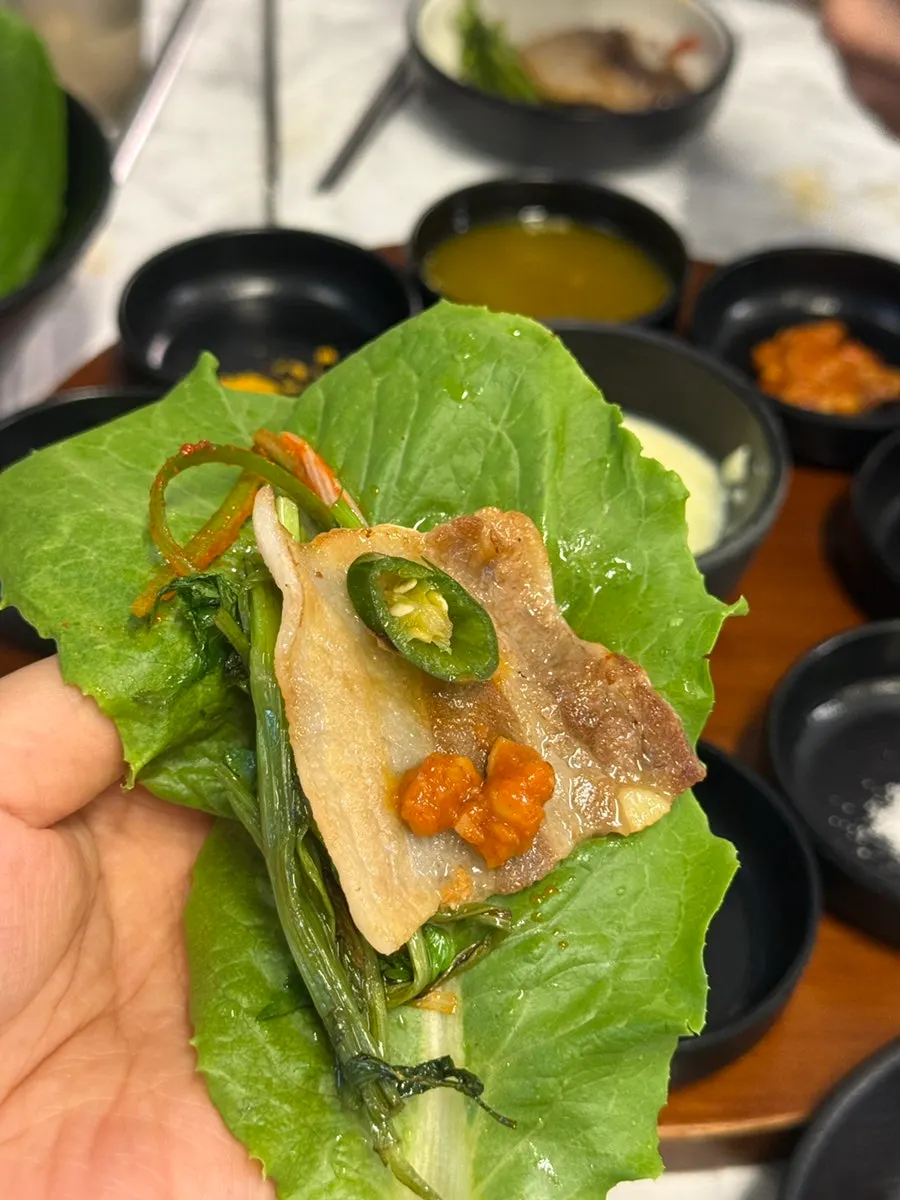 Lettuce wrap with pork belly, minari and garlic
