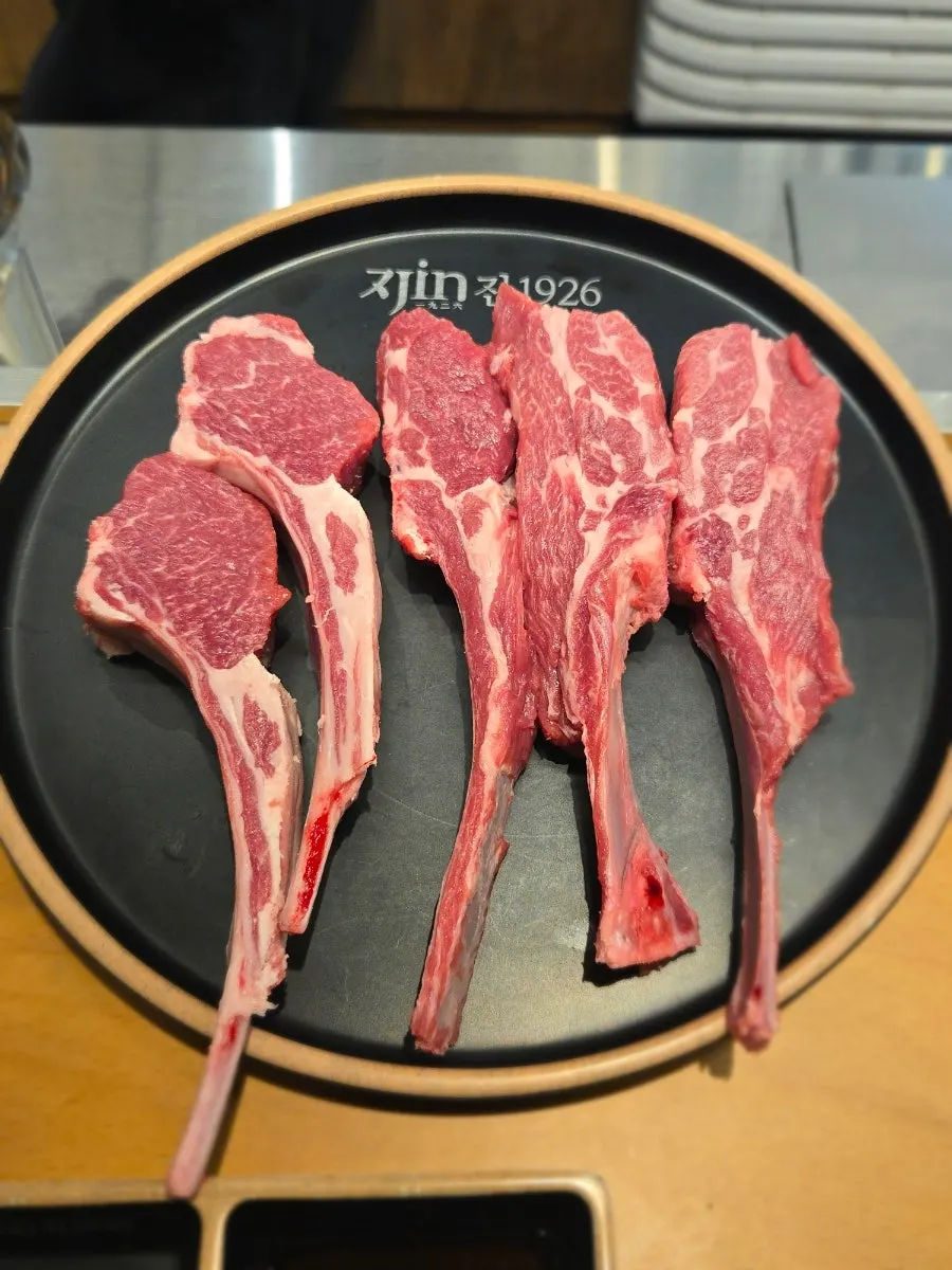 Raw French rack and lamb rack served on a plate