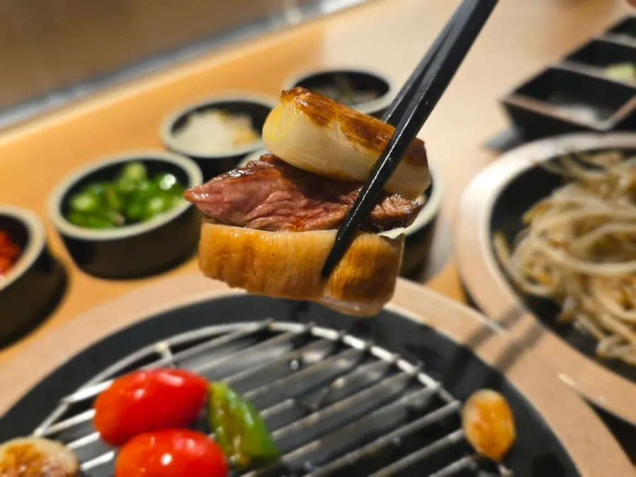 Plate combining lamb with side vegetables