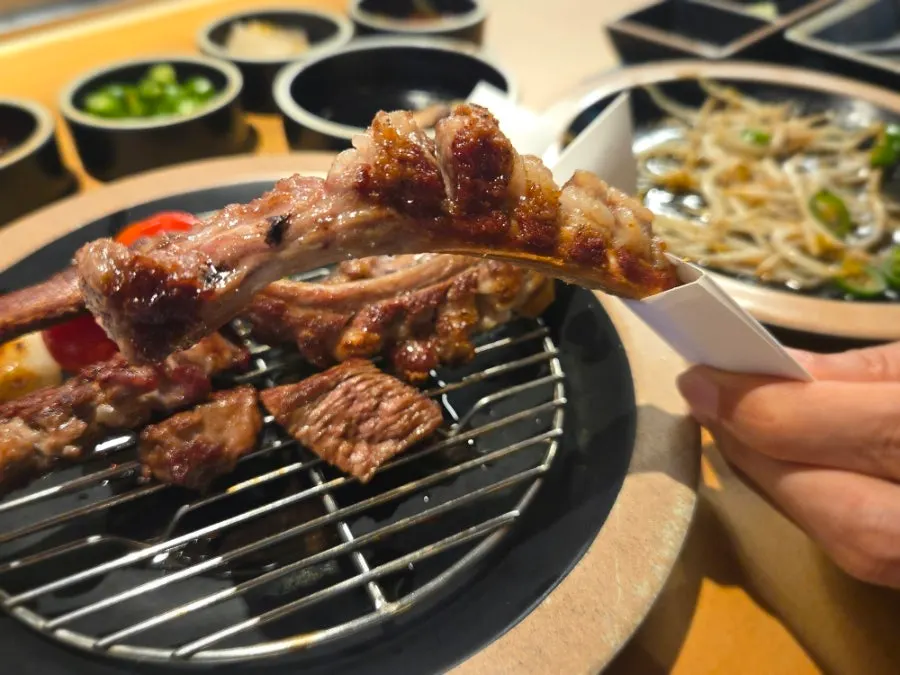Commemorative photo holding the grilled bone
