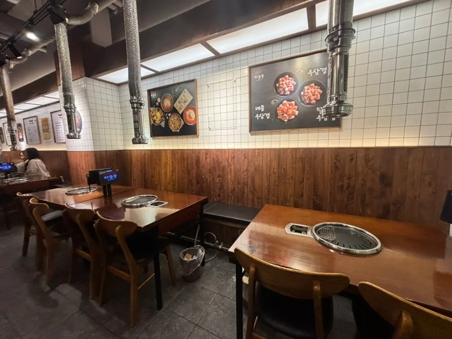 Table seating at Chadolpung with storage space under the chairs