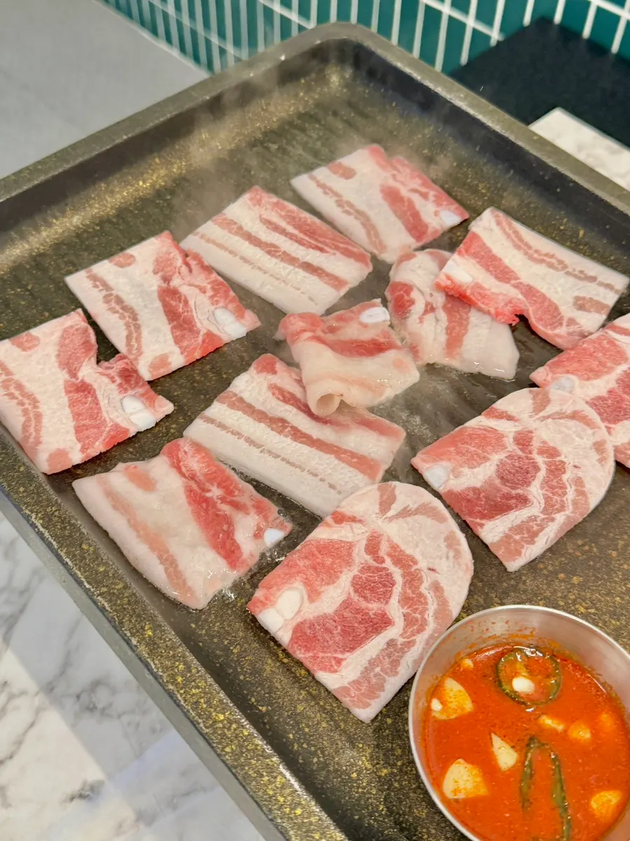Meat grilling on the stone plate