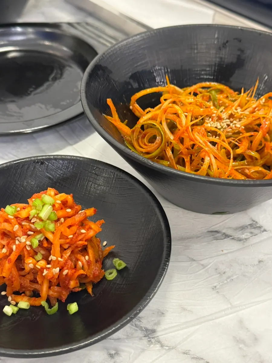 Neatly arranged side dishes including curry powder and barley ssamjang