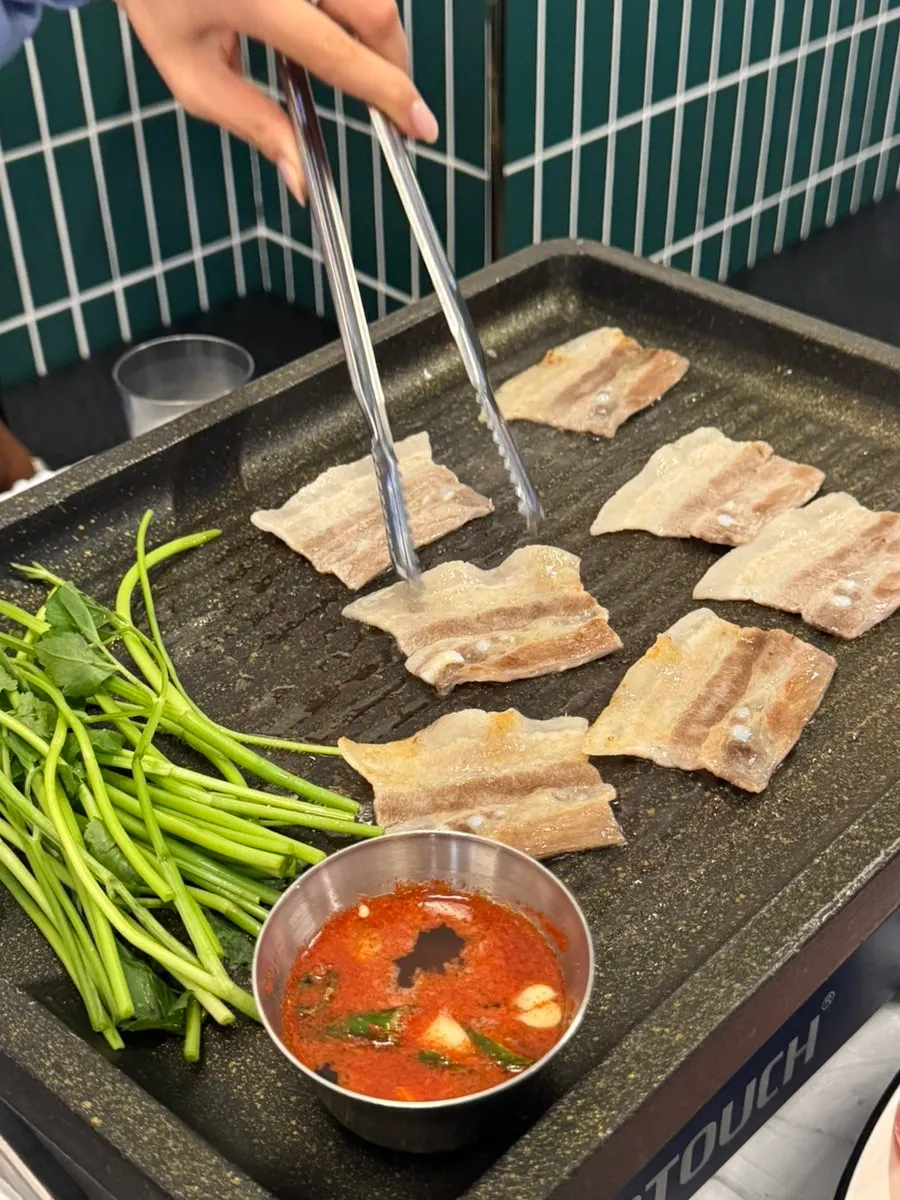 Grilled pork belly paired with shredded scallions