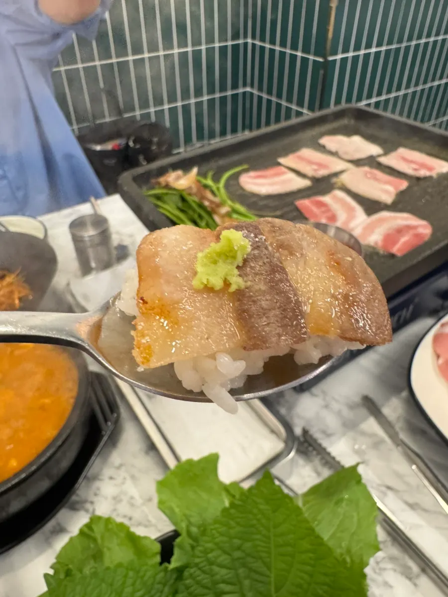 Table spread with pork belly and cheonggukjang stew together
