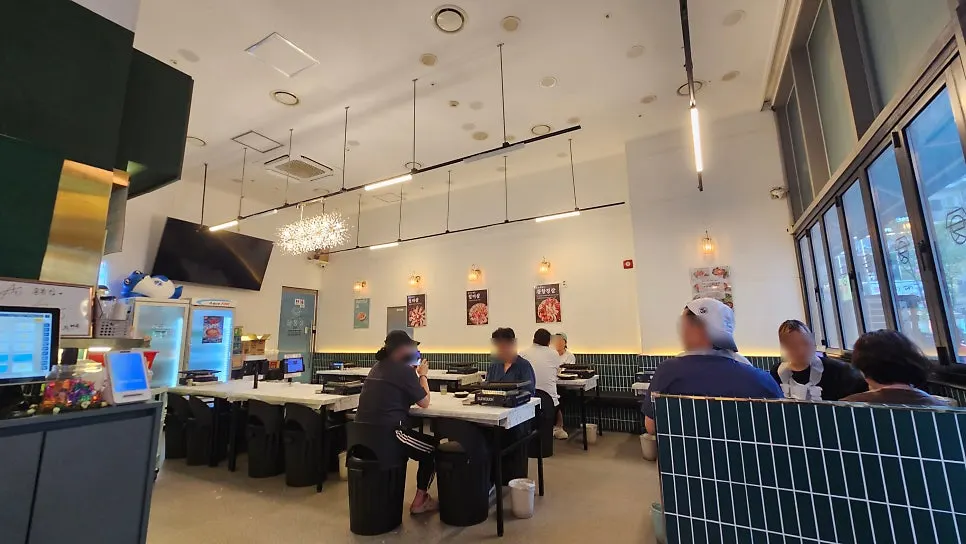 Restaurant interior in white tones with green tile