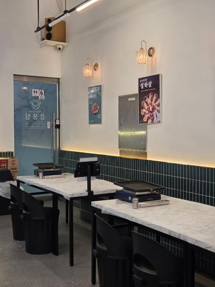Interior of Eungbongjip with tables seating four