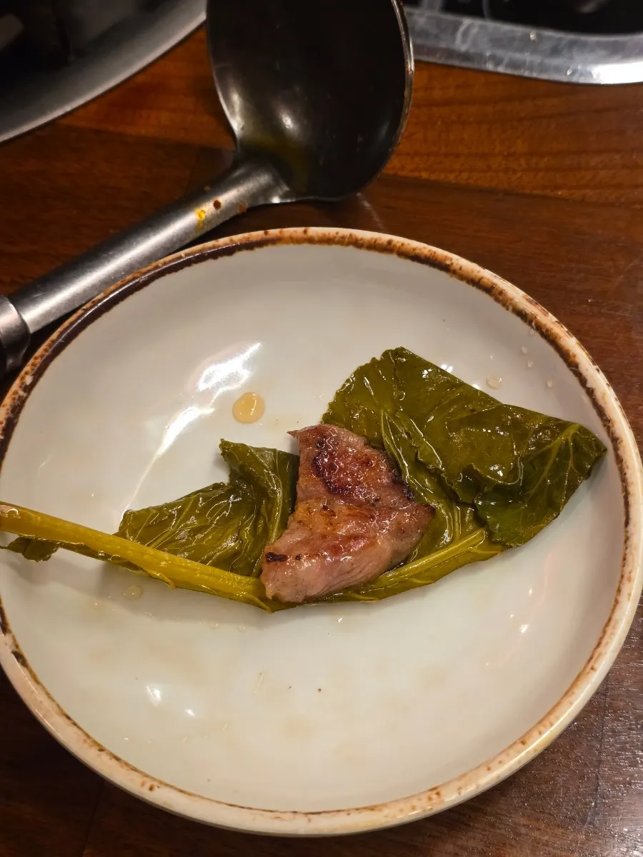 Galbi and herb sides dipped in garlic oil sauce