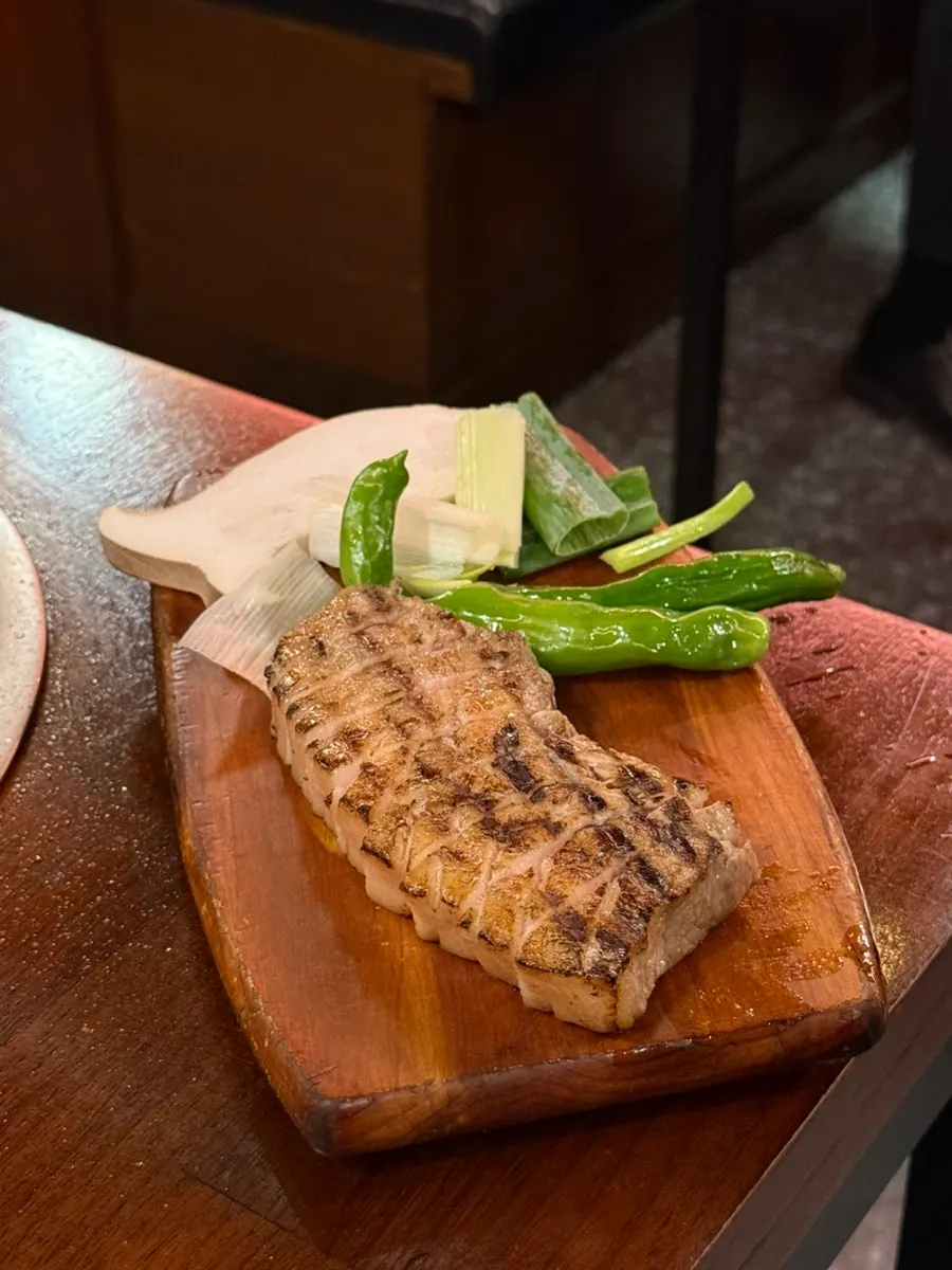 A plate of pre-seared aged Korean pork belly
