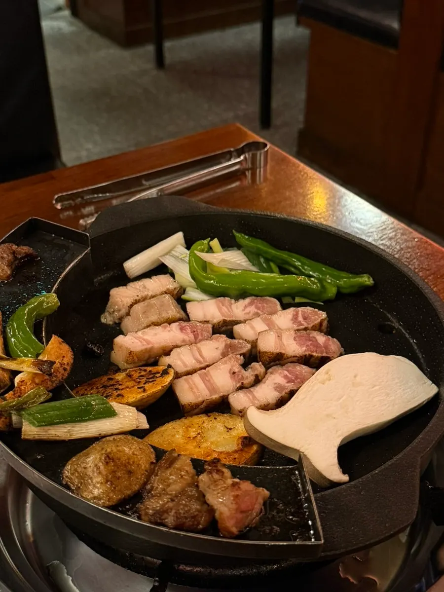 Aged Korean pork belly grilling on the pan