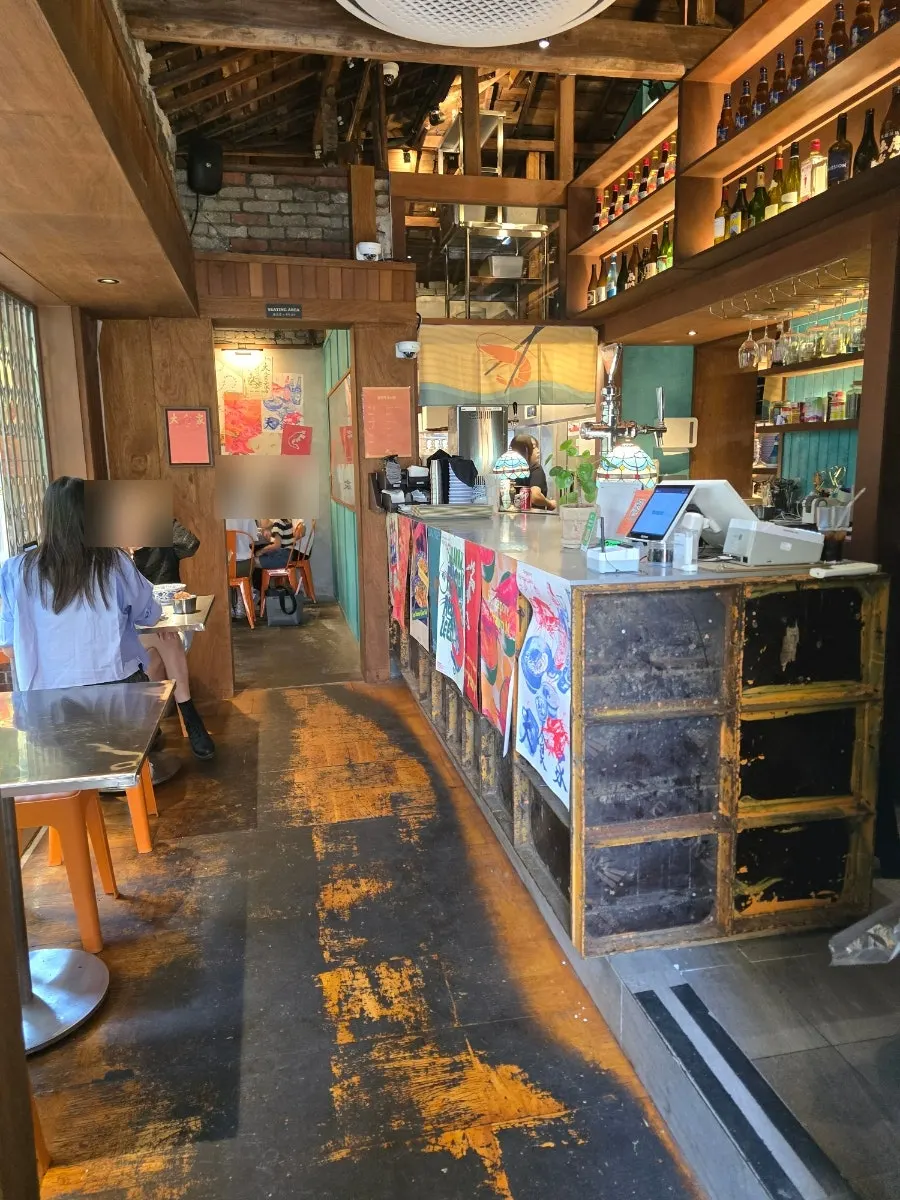 Interior seating and decor at Ttasijia Yeonnam