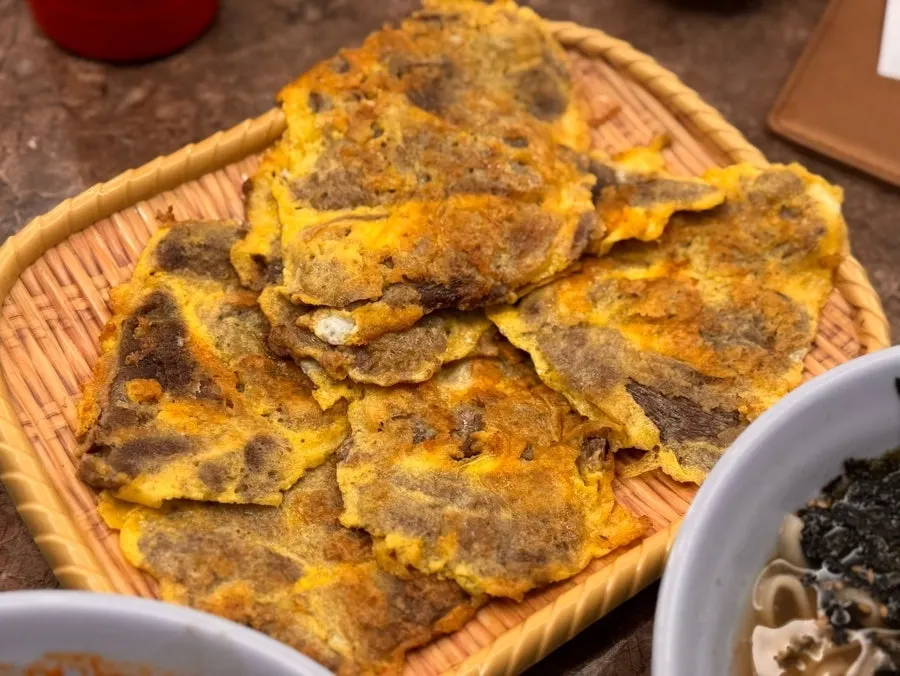 Egg-coated yukjeon pan-fried at Daseon Kalguksu