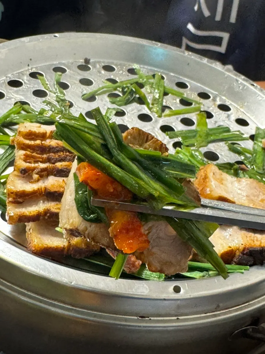 Plate of boiled pork with pickled radish salad
