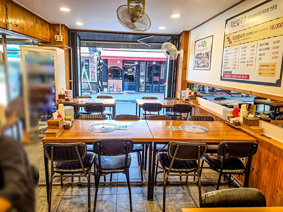 Interior of Daseon Kalguksu with lunch customers