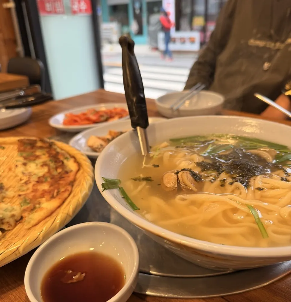 Signature spread of kalguksu dishes at Daseon Kalguksu Main Branch