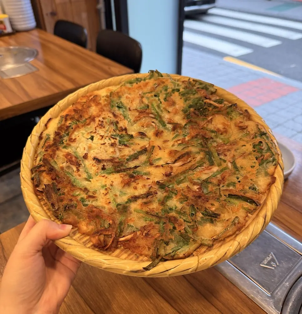 A large seafood pancake served whole