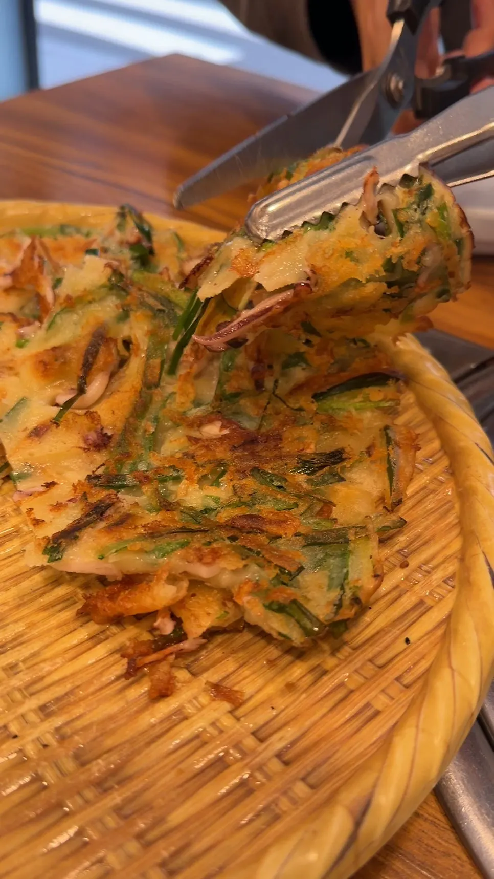 Cutting up the seafood pancake