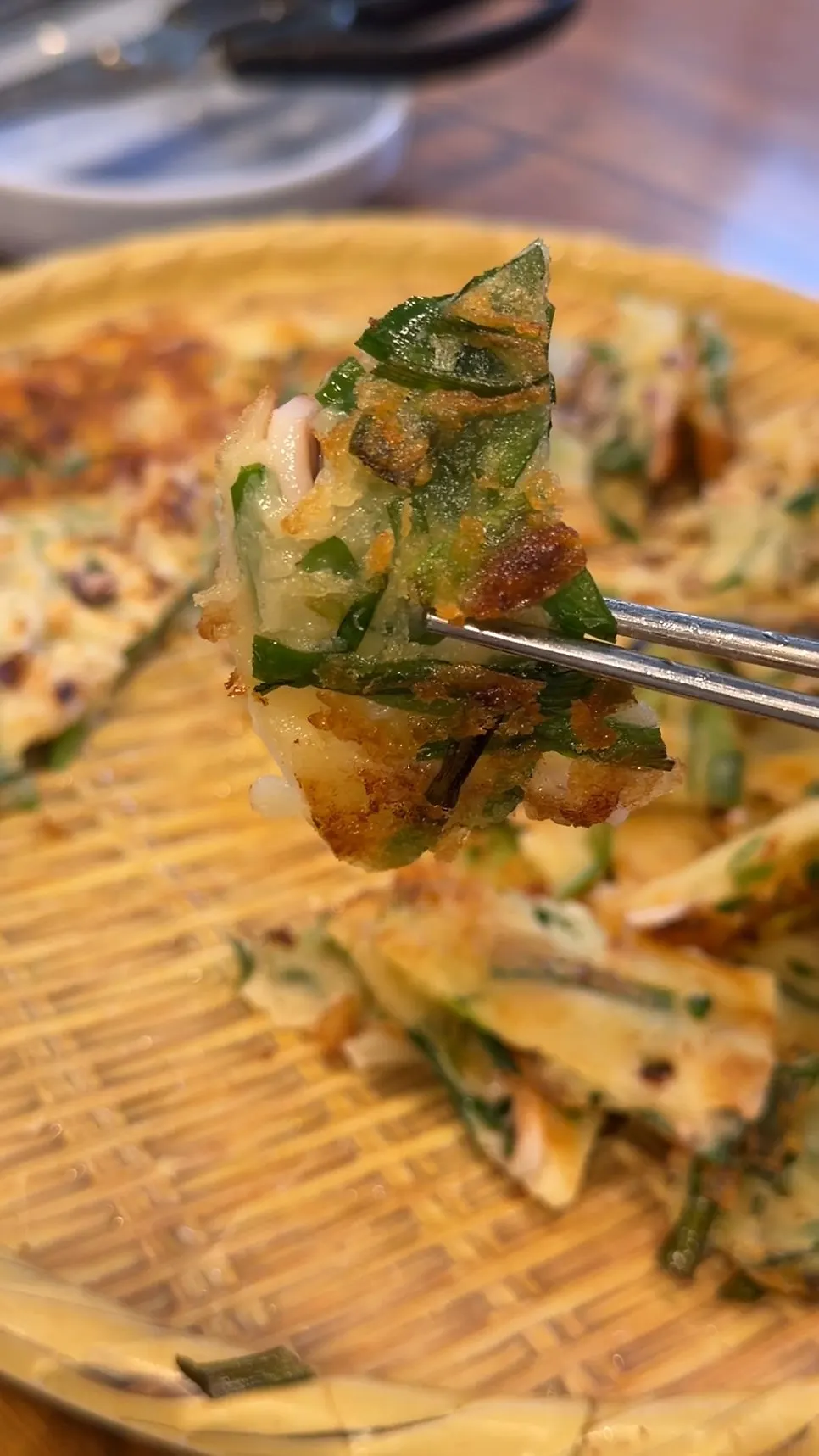 Cross-section of seafood pancake packed with squid