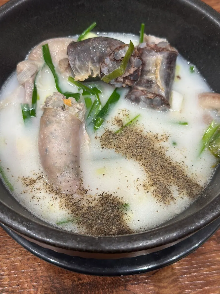 Offal and chives inside the soup