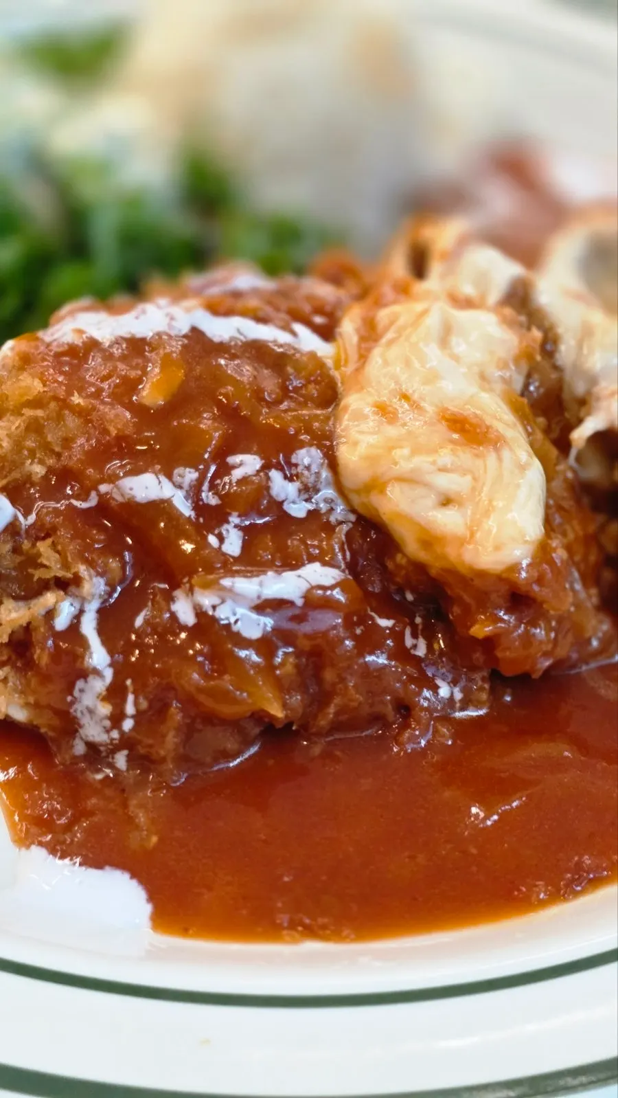 A piece of cheese pork cutlet with stretchy melted cheese