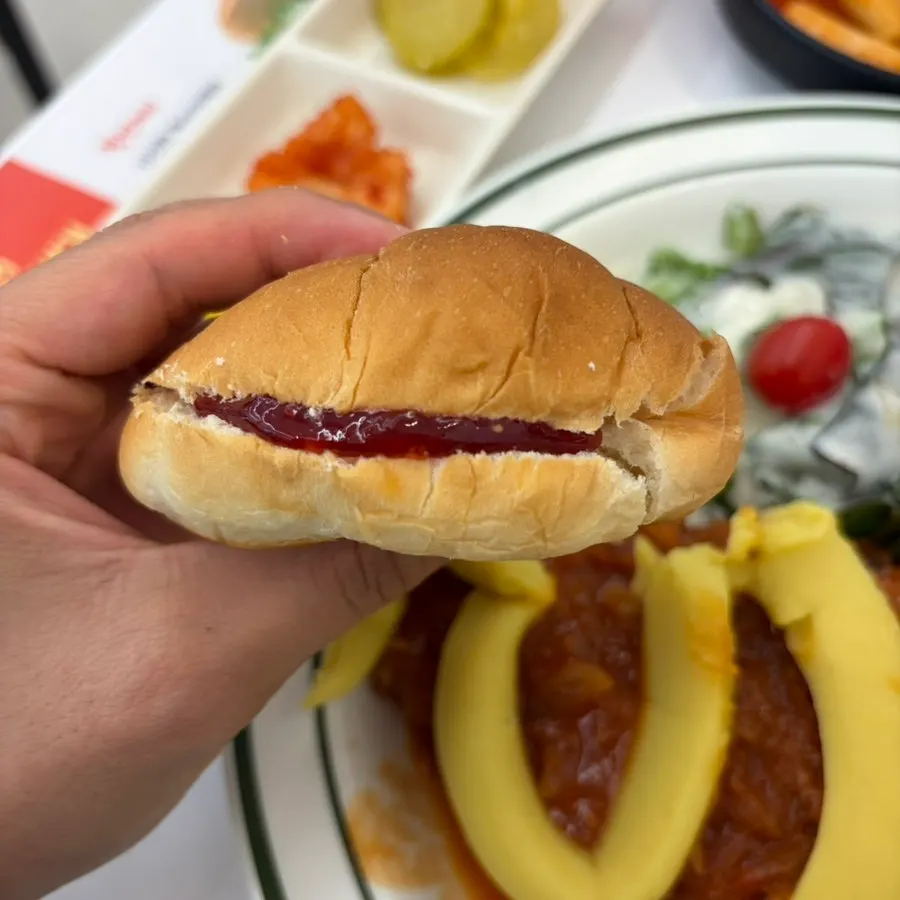 A pork cutlet burger made with a dinner roll