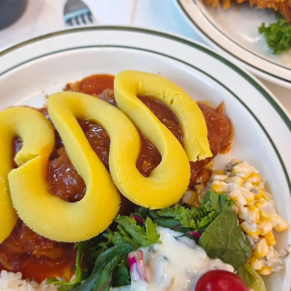 Whole grain salad pork cutlet served with cutlet sauce