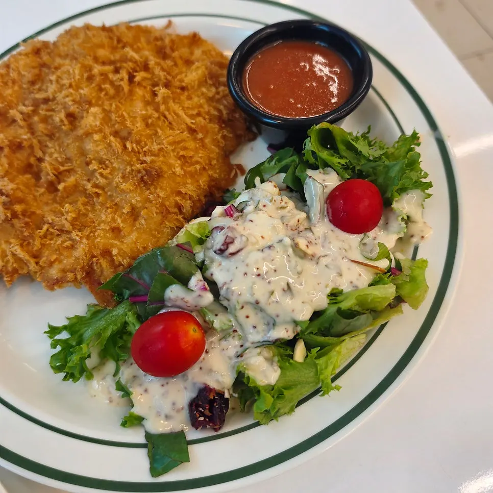 Close-up of sweet potato mousse piled on cheese cutlet