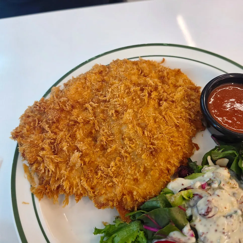 Zoomed-in shot of sweet potato mousse on the cheese cutlet