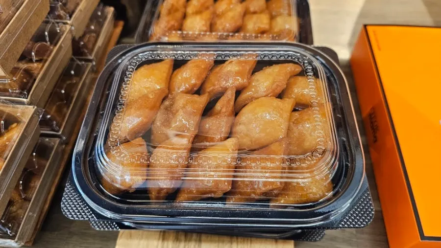 Syrup-soaked hand-made yakgwa served with an Americano