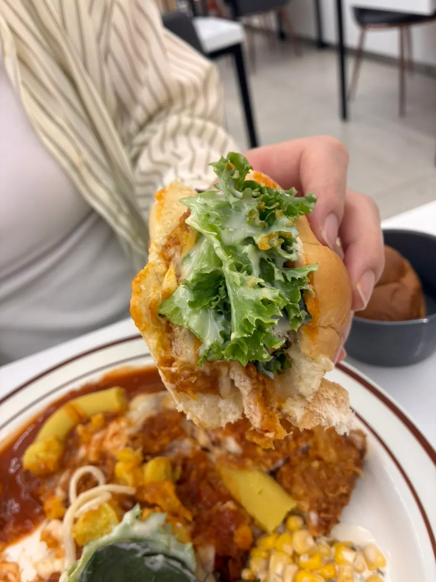 A table with cutlet and pasta placed together