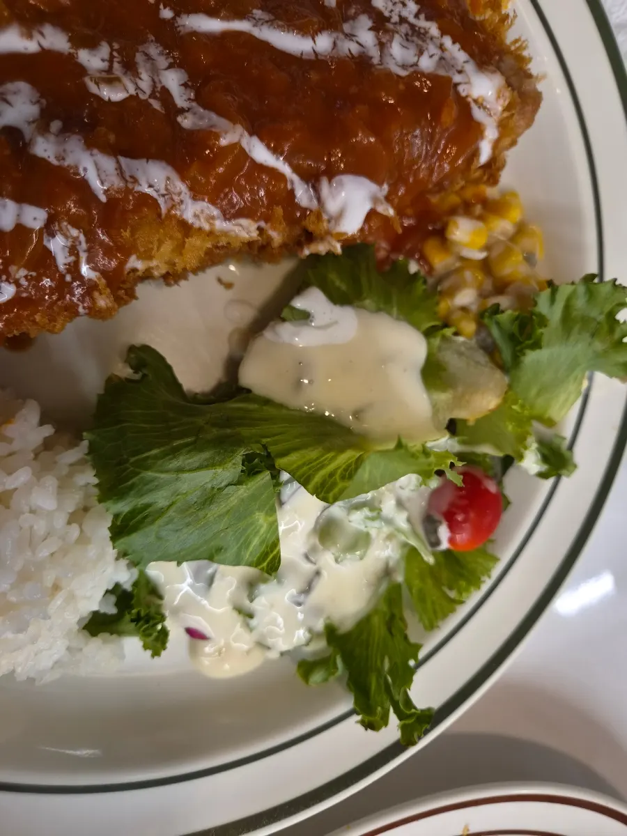 European-style salad drizzled with dressing