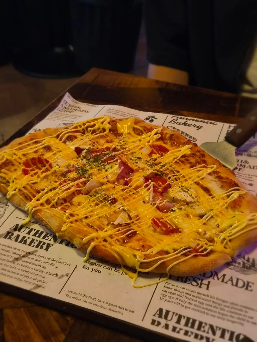 First pizza served, a whole handmade-dough Didi's Pizza