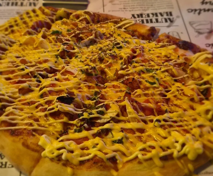 Half-eaten Didi's Pizza on the tray