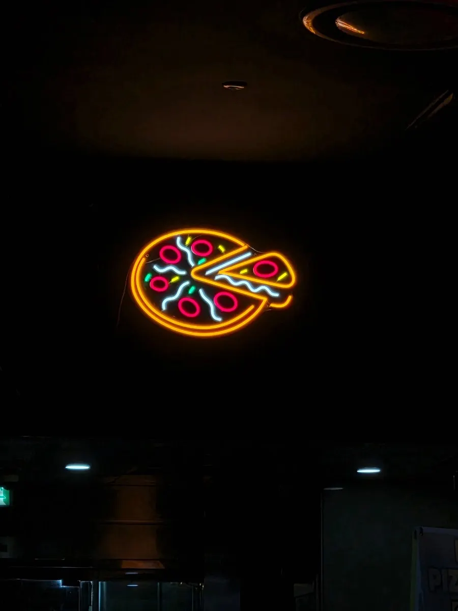 Two pizza trays at Didi's Pizza Pub with two slices left