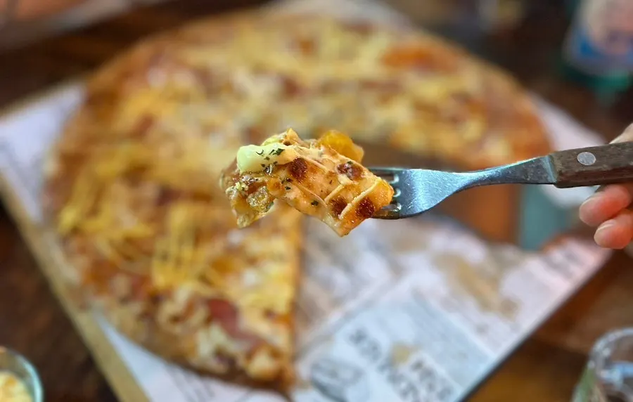 Pizza and soju set together on the table