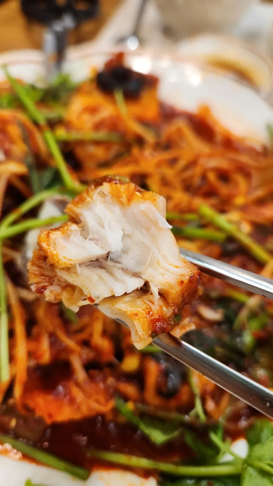 Close-up of plump monkfish meat coated in sauce