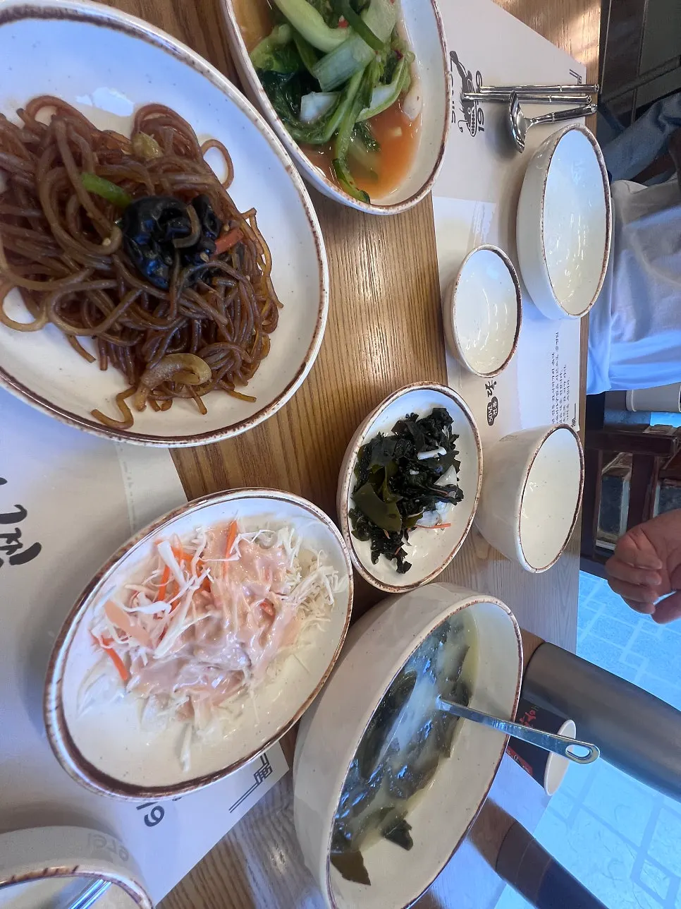 A bowl of agujjim full of bean sprouts and whelks