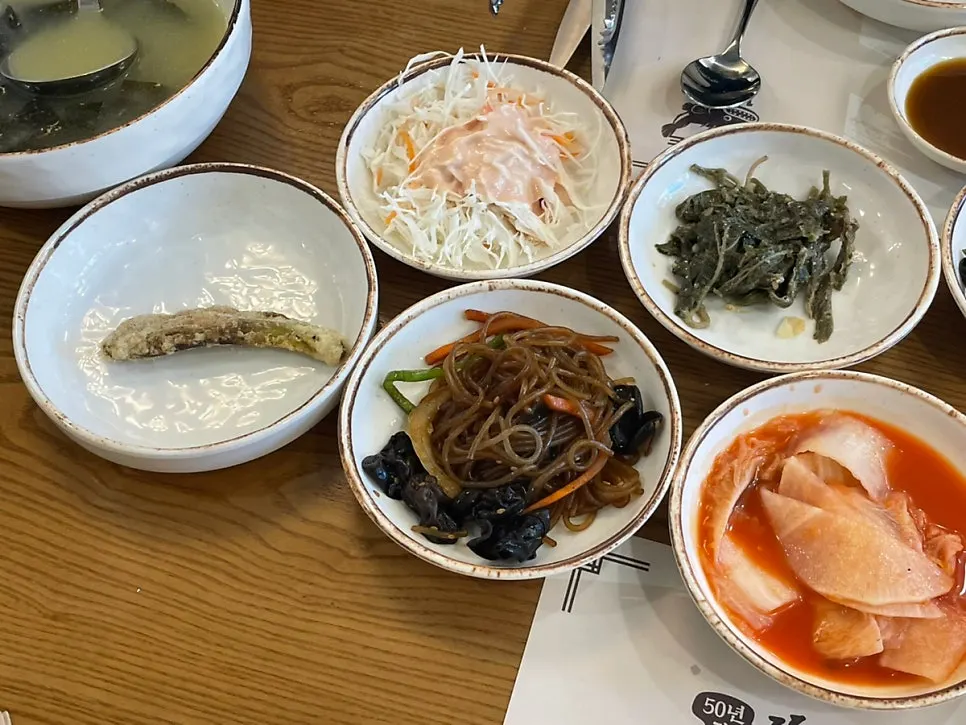 Cabbage salad and fried chili leaves among other side dishes