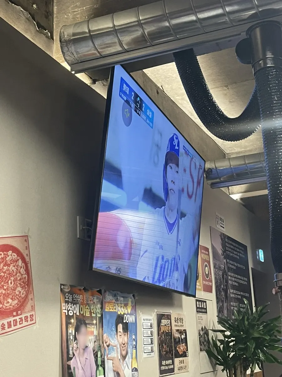Ttukbang interior seating with a large TV