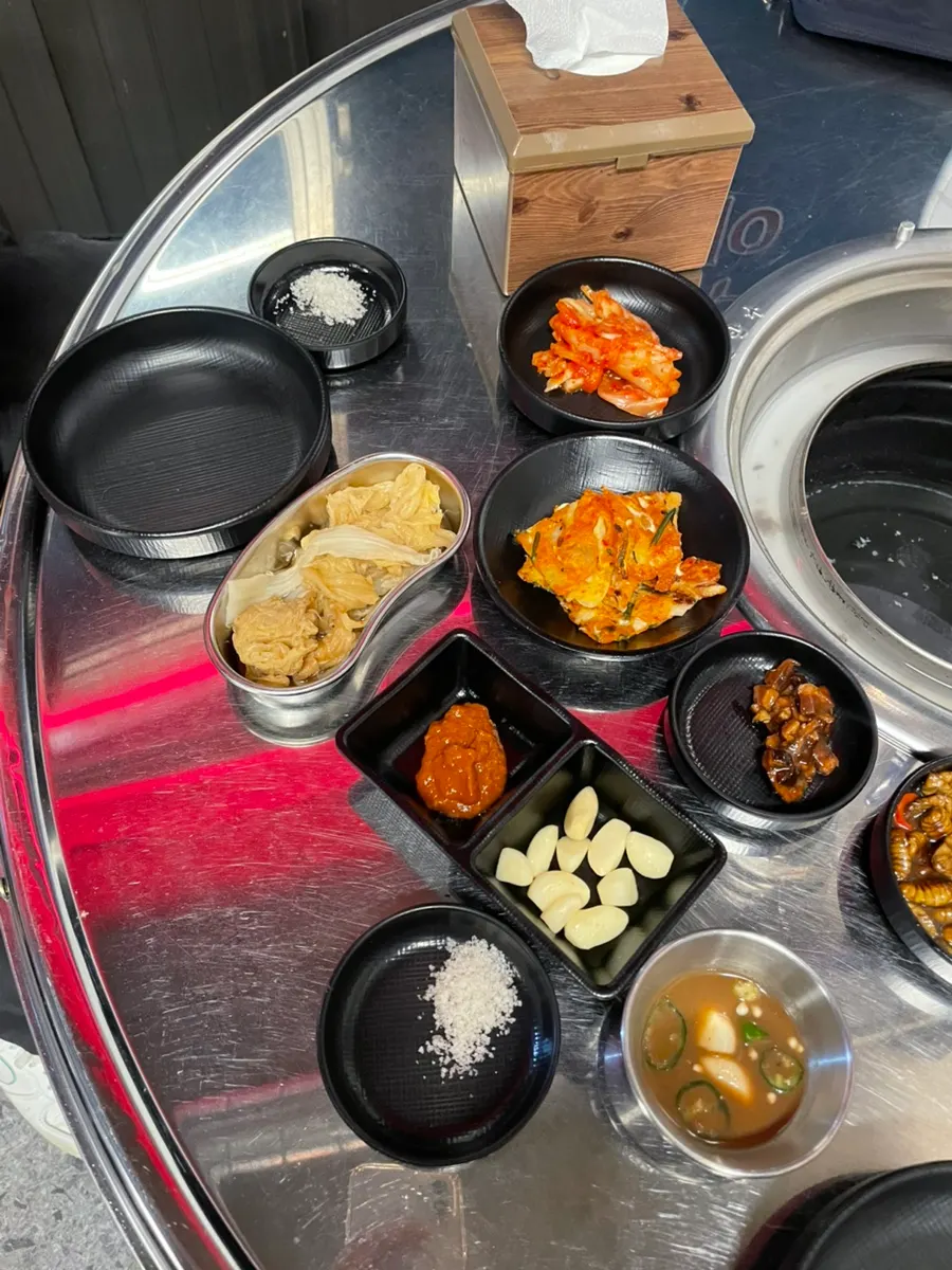 Side dishes at Ttukbang with kimchi and wrap vegetables