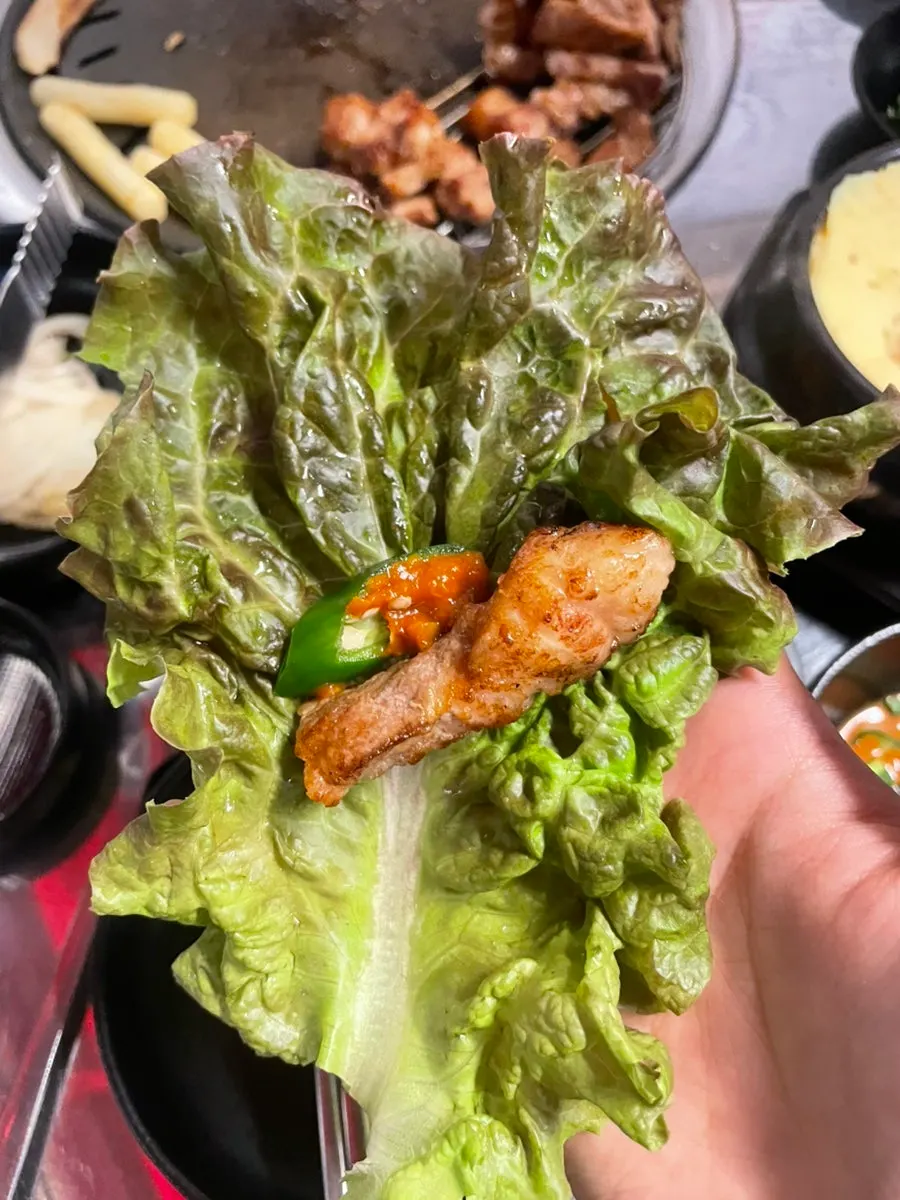 A piece of pork belly dipped in salt